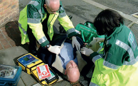 Ambulance personnel using a heartstart defibrillator
